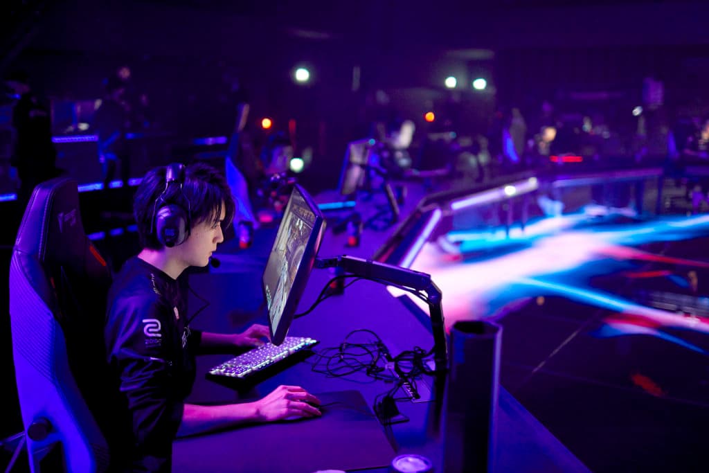 ZETA DIVISION on stage against KRÜ Esports. Laz is in foreground. Image credit: Lance Skundrich/Riot Games.