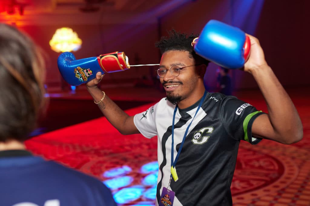 Victor 'Punk' Woodley plays with his boxing gloves at Red Bull Kumite, held in the Octavius Ballroom at Caesar's Palace in Las Vegas, NV, USA on 14 November, 2021. // <em>Marv Watson for Red Bull Content Pool</em>